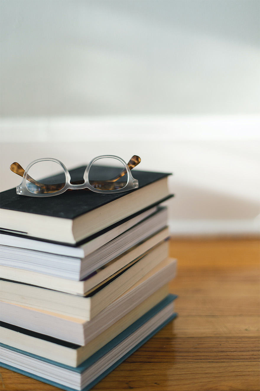 stack of books and glasses