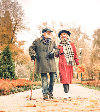older couple walking in the park