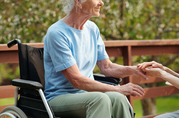 cropped image of a woman in a wheelchair