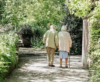 older couple walking ina park