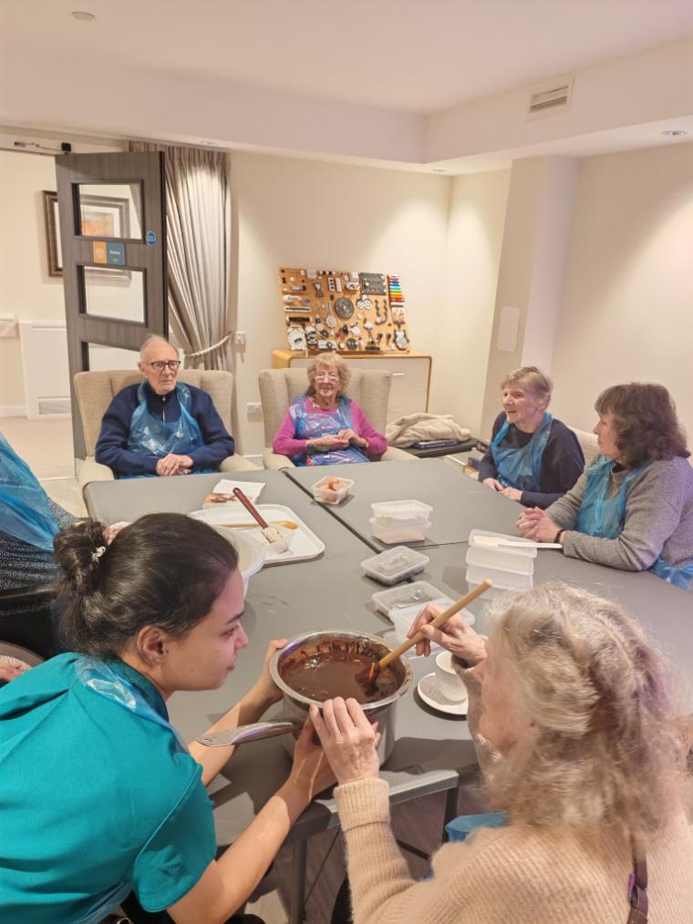 resident mixing brownie mix in a bowl
