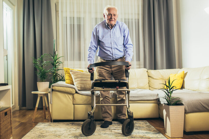 resident using a walking aid