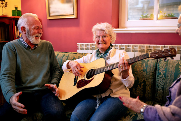 resident playing guitar