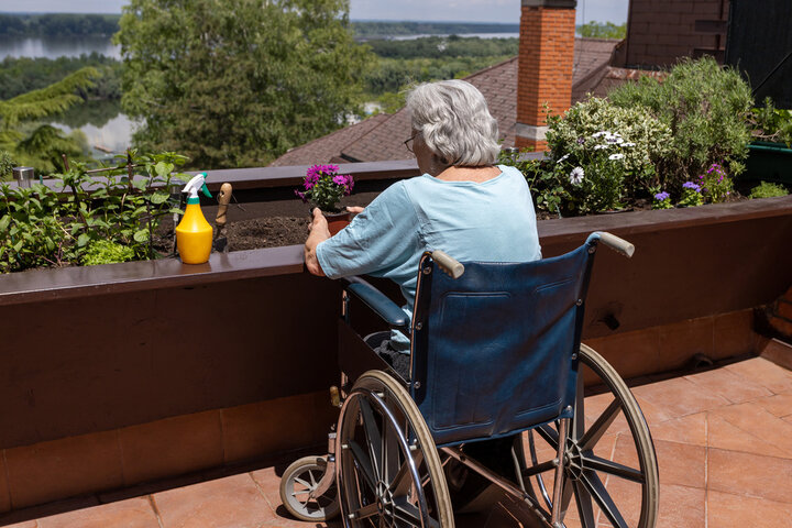 resident doing gardening in a a wheelchair